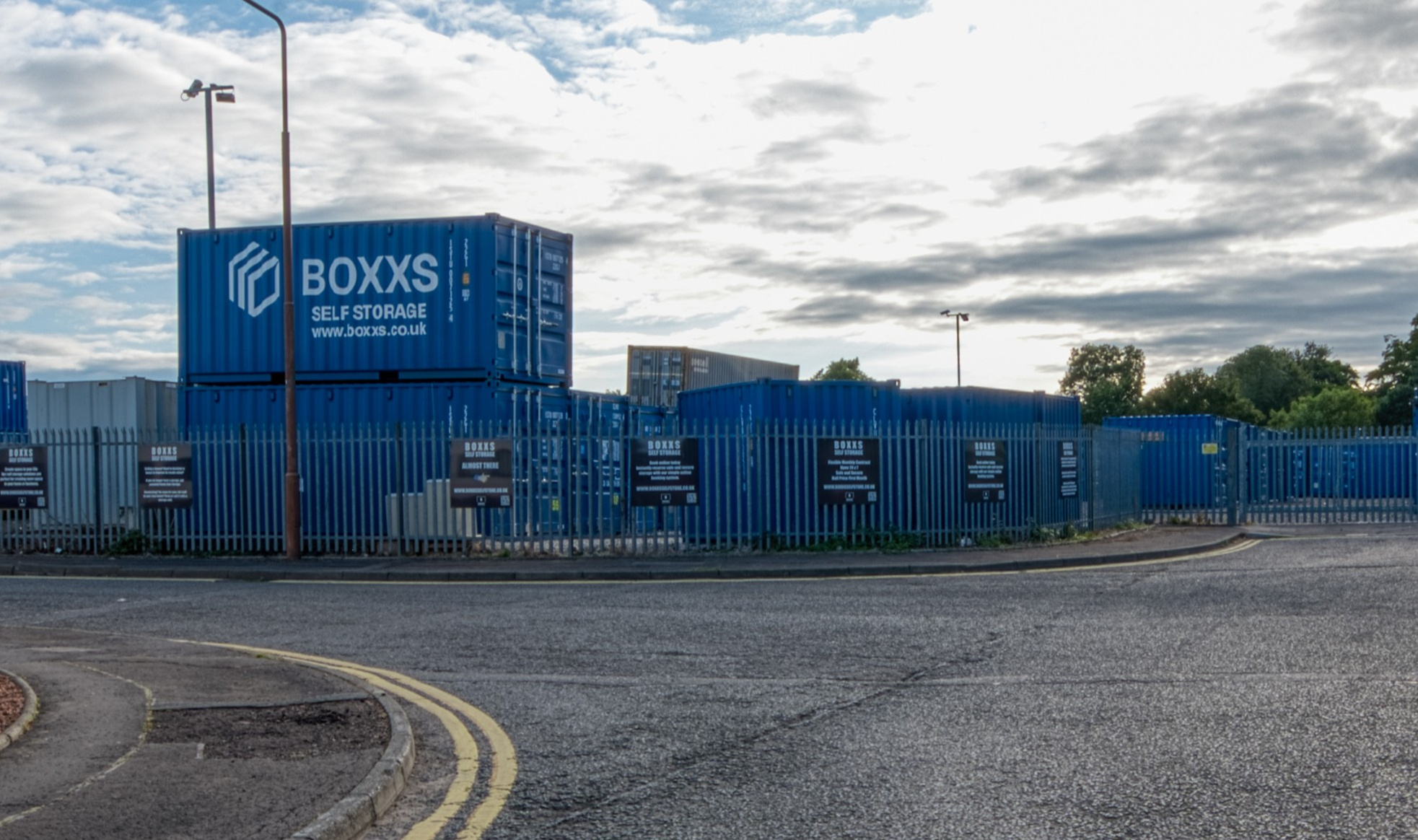 Boxxs self storage entrance with branded container at Linlithgow Alternate angle of Boxxs self storage container with painted logo at the Linlithgow entrance, highlighting secure access for West Lothian and Falkirk customers